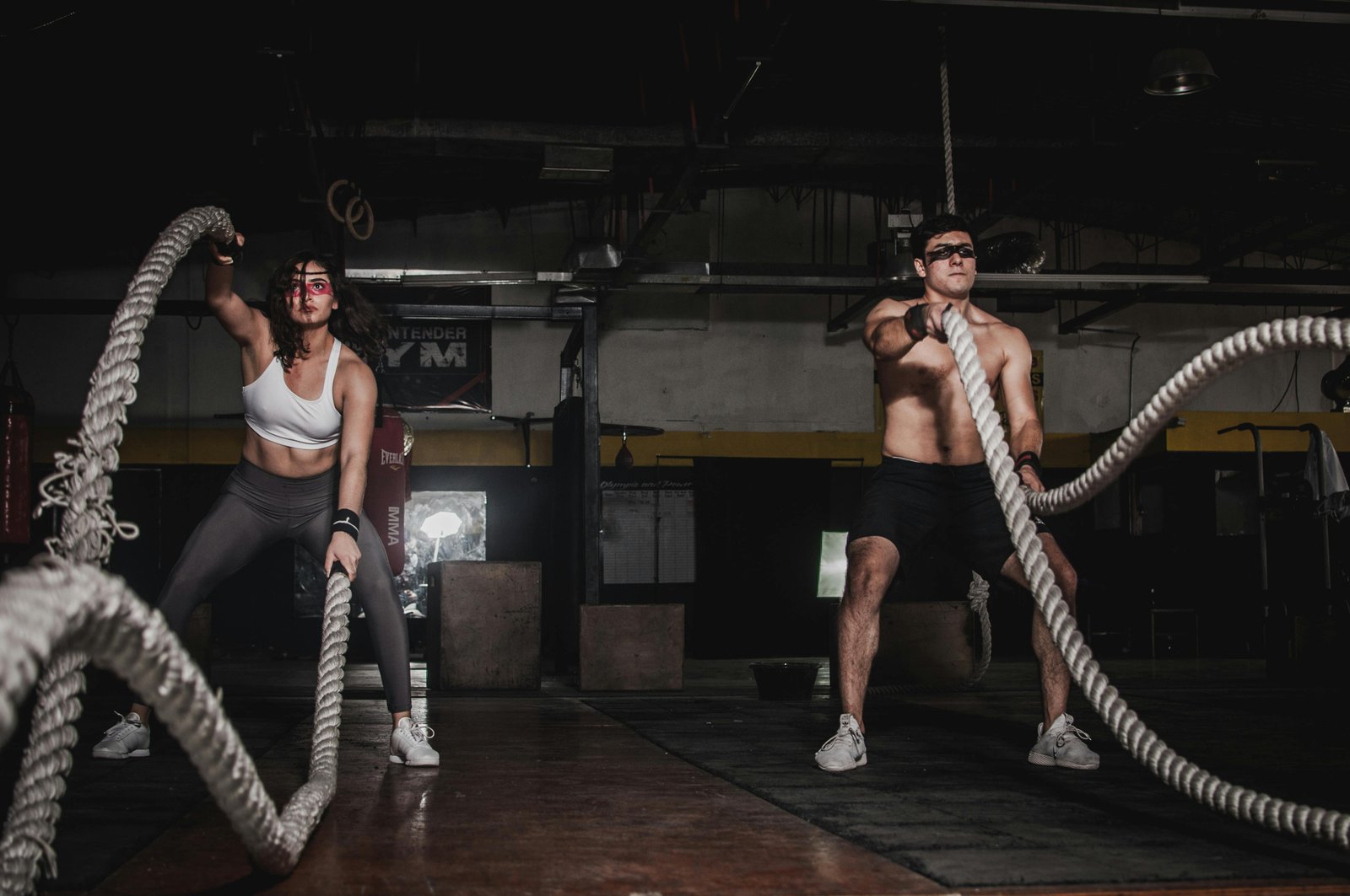 A stock photo of modern premium gym interior with fitness equipment and person working out