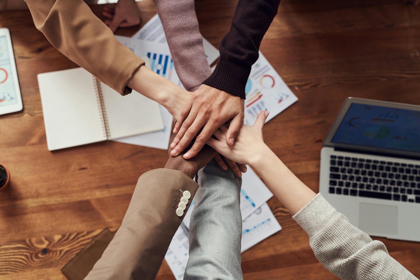 A stock photo of diverse group of young professionals collaborating in a modern vibrant workspace